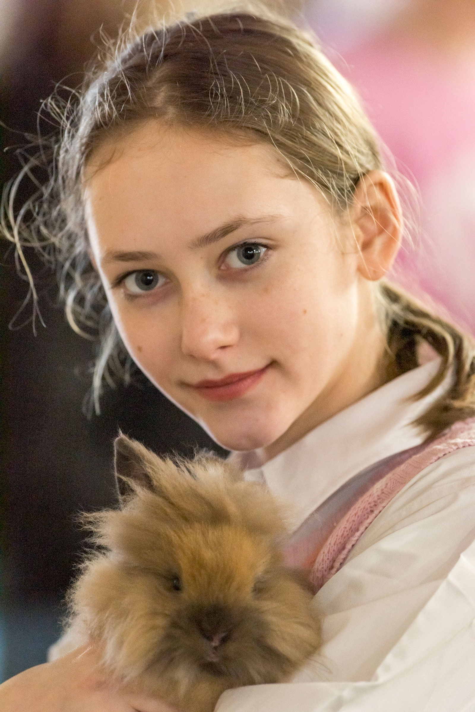 A girl holding a rabbit.